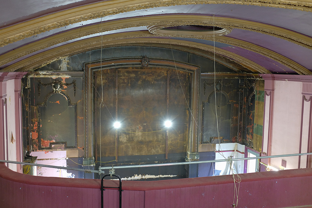 A wide angle shot from the upper auditorium during the rneovation. It shows the far wall where a big screen would be completely empty with the walls ripped out.