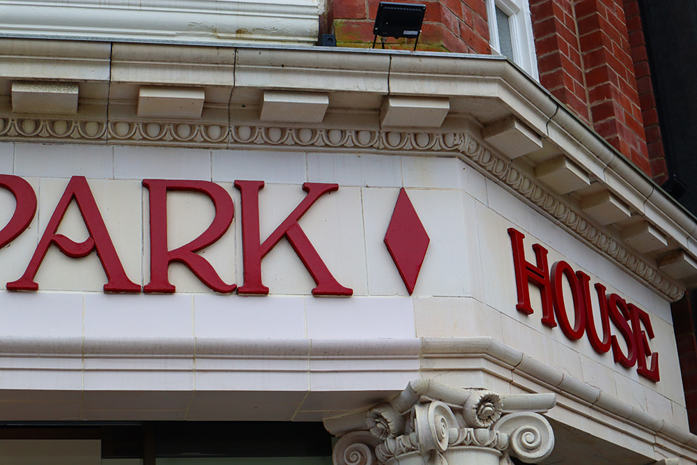 A close up of the outside of Hyde Park Picture Houses red coloured lettering that sits above the entrance.