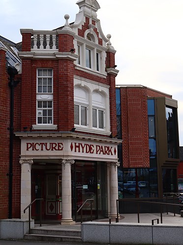 At a similar angle to the above image but in colour, this image shows the new HPPH exterior in 2024 with the new extension on the right of the building.